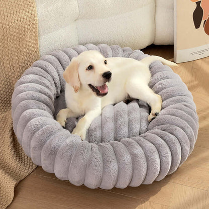 White puppy resting on a grey super soft pet sleeping mat with plush cushioning