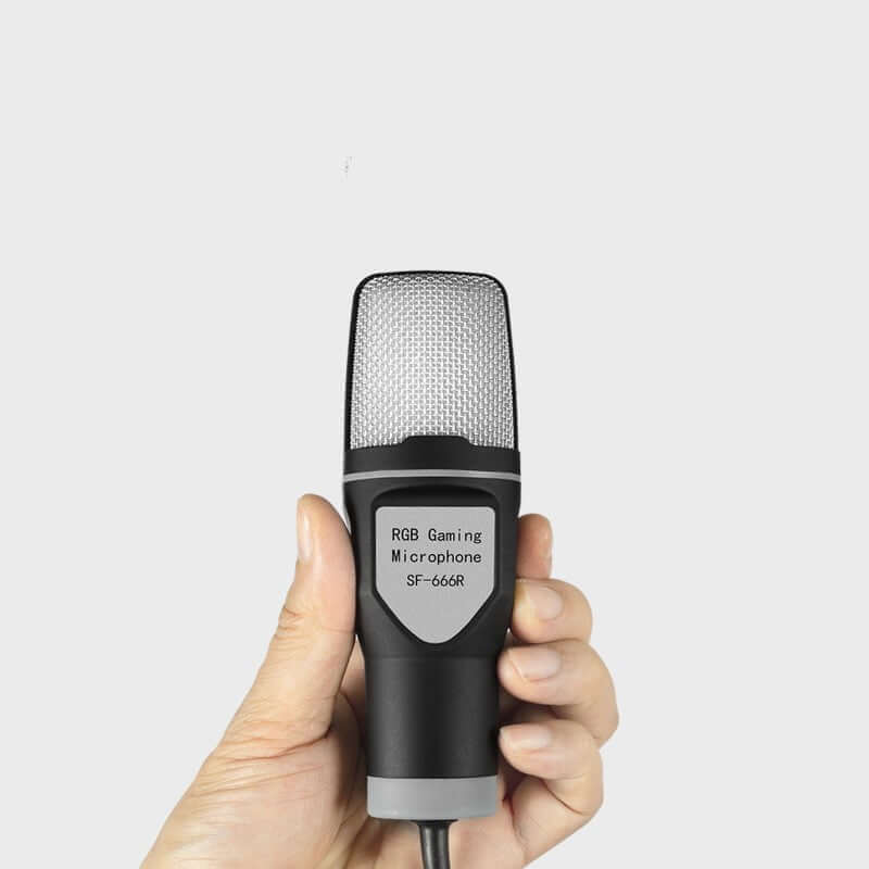 Hand holding a dynamic podcast microphone with stand featuring black and silver design